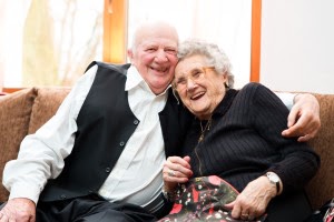 Portrait of an attractive happy senior couple posing close together
